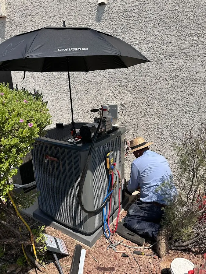 HVAC technician performing outdoor AC maintenance in Murphysboro